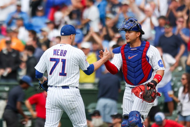 Reliever Jacob Webb and catcher Miguel Amaya celebrate after the final out of the Cubs' 7-6 victory against the Dodgers on Wednesday, Aug. 5, 2026, at Wrigley Field. (Eileen T. Meslar/Chicago Tribune)