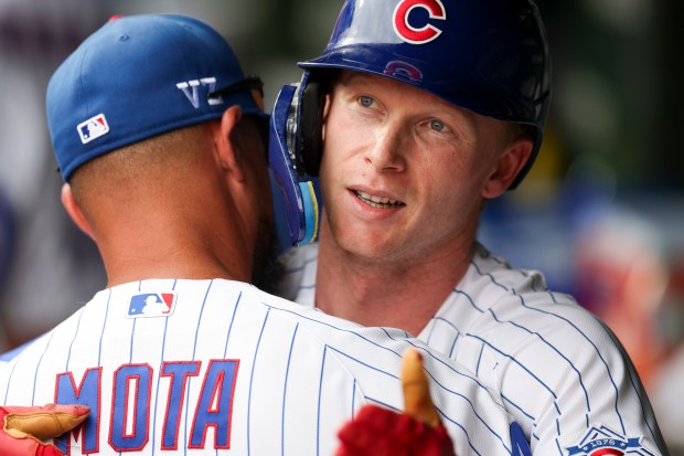 Cubs designated hitter Pete Crow-Armstrong hugs coach Jonathan Mota after hitting a two-run home run in the fourth inning against the Dodgers on Wednesday, Aug. 5, 2026, at Wrigley Field. (Eileen T. Meslar/Chicago Tribune)