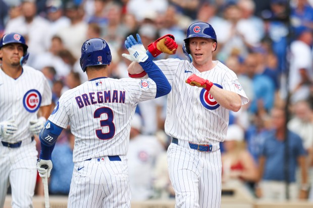 Cubs designated hitter Pete Crow-Armstrong, right, celebrates with third baseman Alex Bregman after hitting a two-run home run in the fourth inning against the Dodgers on Wednesday, Aug. 5, 2026, at Wrigley Field. (Eileen T. Meslar/Chicago Tribune)