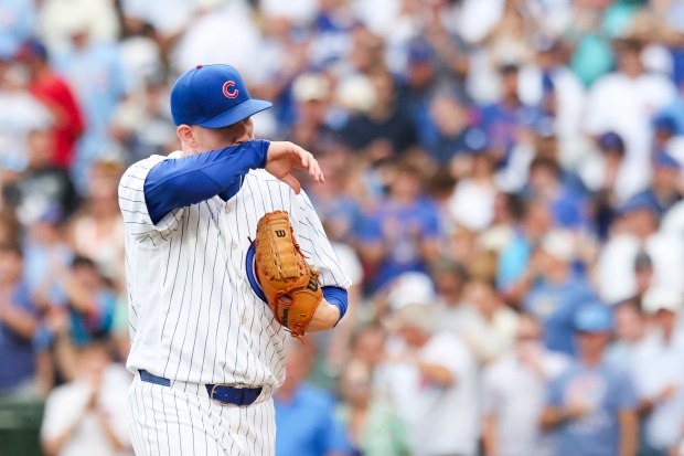 Cubs reliever Ryan Zeferjahn wipes his face after getting out of the eighth inning against the Dodgers on Wednesday, Aug. 5, 2026, at Wrigley Field. (Eileen T. Meslar/Chicago Tribune)