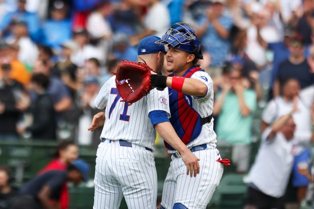 Reliever Jacob Webb (71) and catcher Miguel Amaya celebrate after the final out of the Cubs' 7-6 victory against the Dodgers on Wednesday, Aug. 5, 2026, at Wrigley Field. (Eileen T. Meslar/Chicago Tribune)