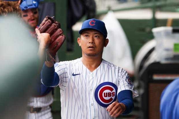 Cubs starter Shota Imanaga fist bumps teammates in the dugout after the top of the fourth inning against the Dodgers on Wednesday, Aug. 5, 2026, at Wrigley Field. (Eileen T. Meslar/Chicago Tribune)