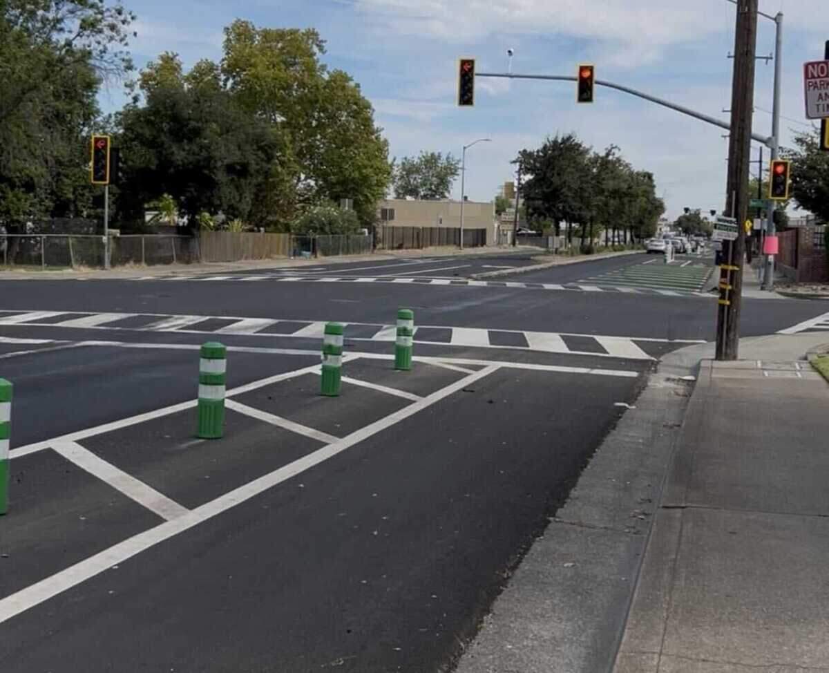 The Marysville Boulevard quick-build project used paint and plastic bollards to reduce traffic lanes and make crosswalks more visible. State traffic safety officials held a news conference nearby Monday to urge drivers to slow down and watch for pedestrians and bicyclists.
