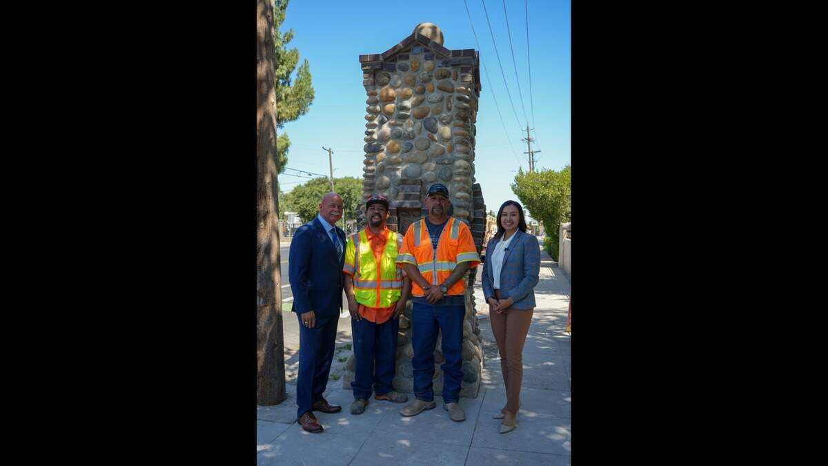 Fresno Mayor Jerry Dyer, Gabriel Valdovinos, Roger Ruelas and Fresno City Councilmember Annalisa Perea at the restored historic pillar in the Fresno High neighborhood that was damaged in a car crash.