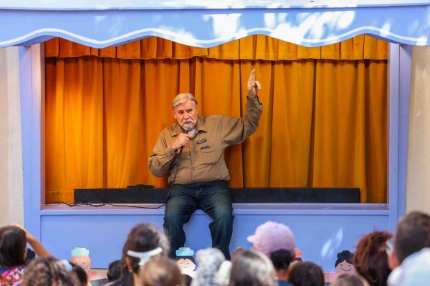 Children's Fairyland puppet theater director Randal Metz speaks before visitors before "The Three Little Pigs" puppet show during the 70th anniversary of the Storybook Puppet Theater at Children's Fairyland in Oakland, Calif., on Saturday, Aug. 29, 2026. The weekend Puppet Fair featured performances on multiple stages by the San Francisco Bay Area Puppeteers Guild and other artists, a display of historic puppets and hands-on workshops where children made rod puppets. "It's like Coachella for people who love puppets, puppet shows and puppeteers," organizers said. (Ray Chavez/Bay Area News Group)