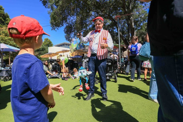 Puppeteer Tom Jensen, of San Diego, performs with his puppet Timothy Teapot during the 70th anniversary of the Storybook Puppet Theater at Children's Fairyland in Oakland, Calif., on Saturday, Aug. 29, 2026. Jensen said he has been a puppeteer for about 60 years. The weekend Puppet Fair featured performances on multiple stages by the San Francisco Bay Area Puppeteers Guild and other artists, a display of historic puppets and hands-on workshops where children made rod puppets. "It's like Coachella for people who love puppets, puppet shows and puppeteers," organizers said. (Ray Chavez/Bay Area News Group)