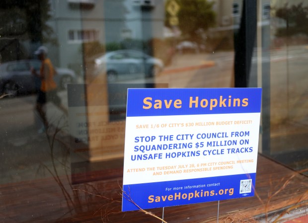 Signage along Hopkins Street on Thursday, Aug. 13, 2026, in Berkeley, Calif. The city of Berkeley is looking at removing over a hundred parking spaces along Hopkins Street for a new bike lane project. (Aric Crabb/Bay Area News Group)