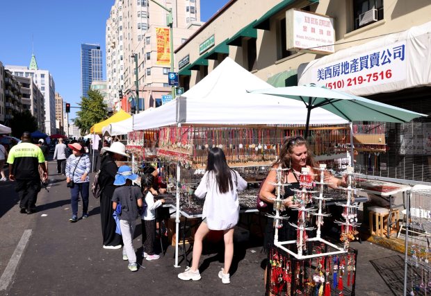People browse craft booths during the 35th Oakland Chinatown StreetFest in downtown Oakland, Calif., on Sunday, August 25, 2024. (Jane Tyska/Bay Area News Group)