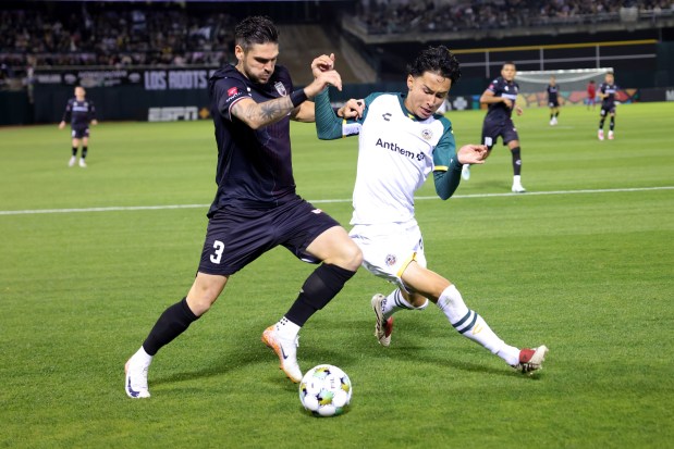 San Antonio's Mitchell Taintor (3) and Oakland Roots' Ilya Alekseev (88) fight for the ball during the second half of the home opener of a USL soccer match at the Oakland-Alameda County Coliseum in Oakland, Calif., on Saturday, March 22, 2025. (Ray Chavez/Bay Area News Group)