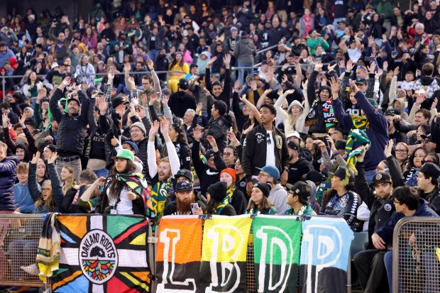 Fans take part in the wave during the Oakland Roots home opener against the San Antonio FC at the Oakland-Alameda County Coliseum in Oakland, Calif., on Saturday, March 22, 2025. (Ray Chavez/Bay Area News Group)