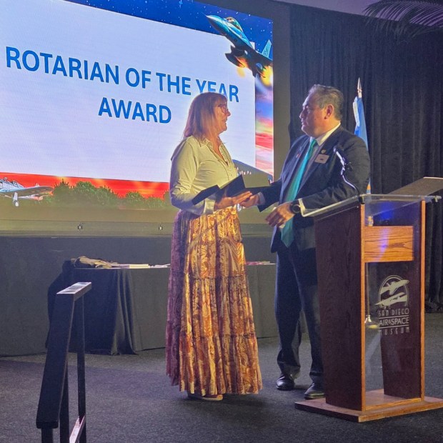 Sherry Yardley, Rotary District 5340 Rotarian of the Year, receives her award from 2025-2026 District Governor Luis Carranza(Michael Clancy)
