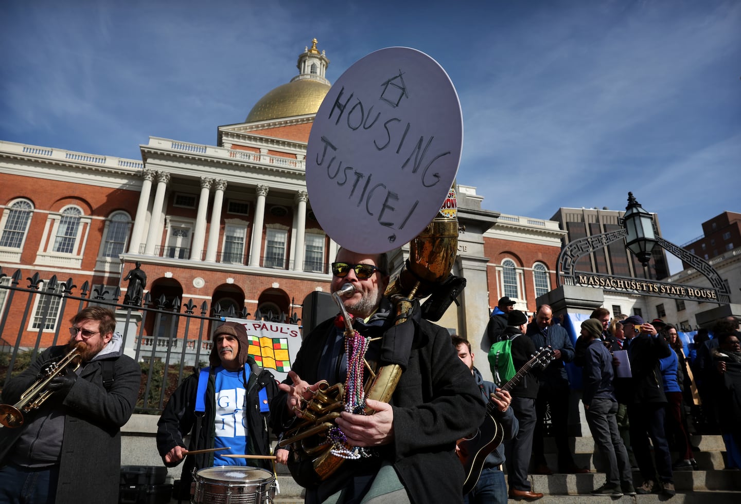 Kirk Israel, of Boston Area Brigade of Activist Musicians, played his tuba during a rally held by the Greater Boston Interfaith Organization outside the State House in 2023. 