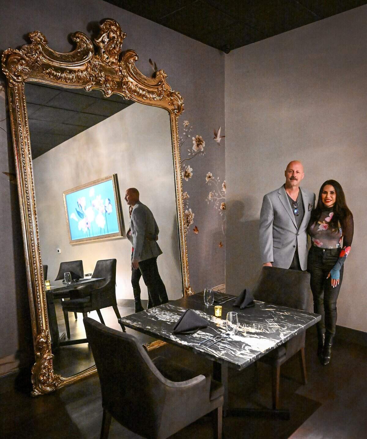 Tom and Davita Miller stand next to a 400-year-old mirror at their restaurant, Bulle, in northwest Fresno on Tuesday, April 22, 2026.