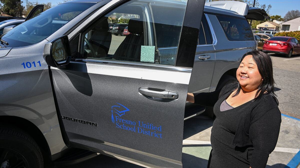 Fort Miller Middle School Community School coordinator Xee Xiong shows the program’s Chevrolet Suburban vehicle, which gives the school flexibility in transporting teachers and students for various activities, while at the Fresno school on Friday, March 8, 2024. Fort Miller Middle School Community School coordinator Xee Xiong shows the program’s Chevrolet Suburban vehicle, which gives the school flexibility in transporting teachers and students for various activities, while at the Fresno school on Friday, March 8, 2024.