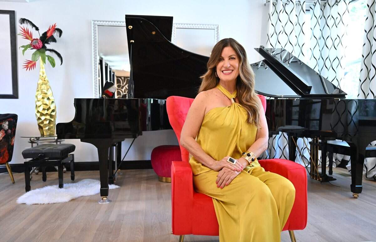 Pianist Gina Lenee sits in her Harmony House on Van Ness Avenue near Fresno High. Photographed Thursday, July 31, 2026.