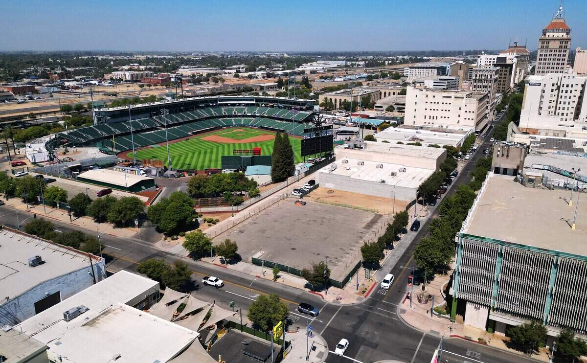 The empty lot at Inyo and Fulton streets, center, future site of The Park at South Stadium apartments seen Aug. 5, 2026 in downtown Fresno.