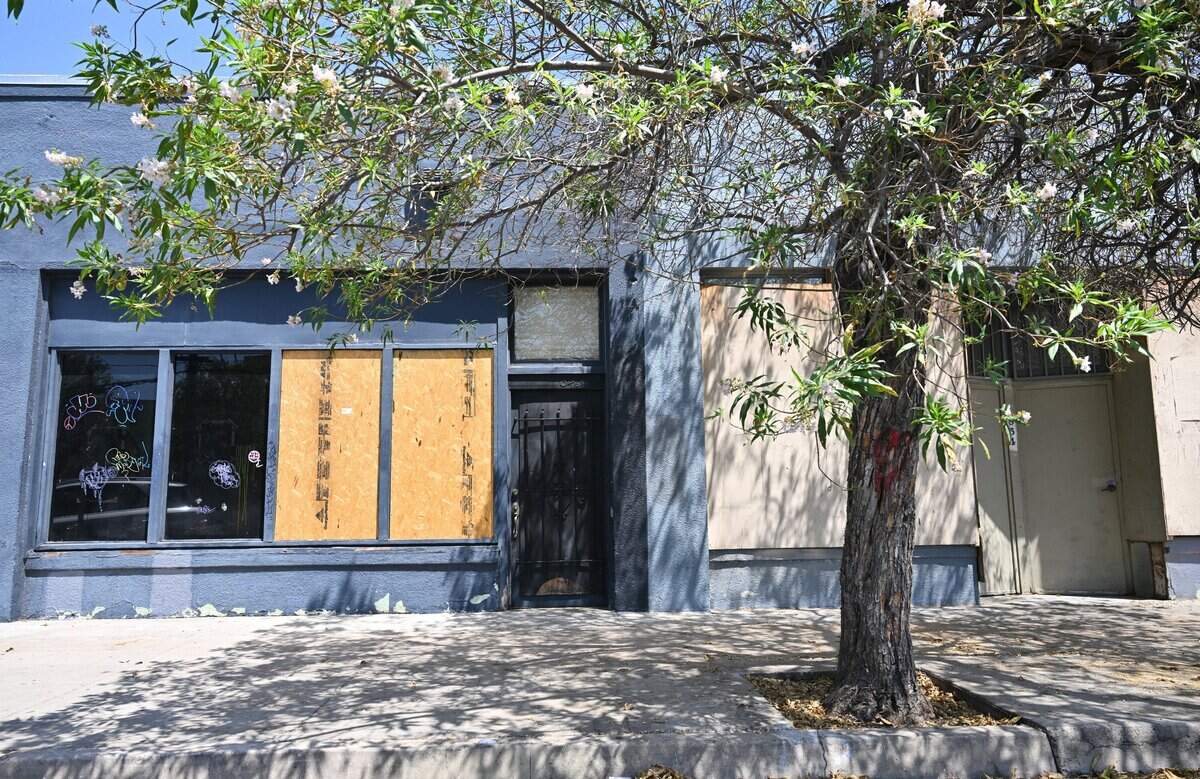 The former site of The Brass Unicorn, left, is seen closed and boarded with other businesses along Fern Street in the Tower District, photographed Thursday, Aug. 6, 2026 in Fresno.
