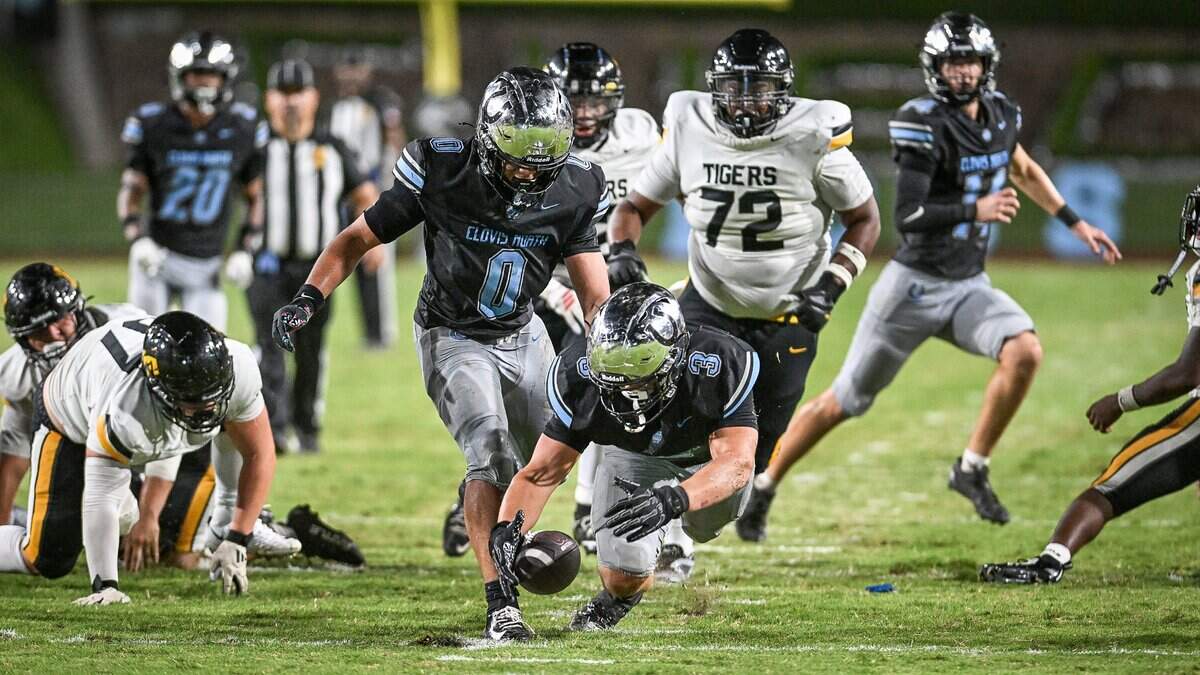 Clovis North’s Cooper Haydock, center, dives on the ball after the Broncos caused an Edison fumble late in their game at Veterans Memorial Stadium in Clovis on Thursday, Aug. 27, 2026.