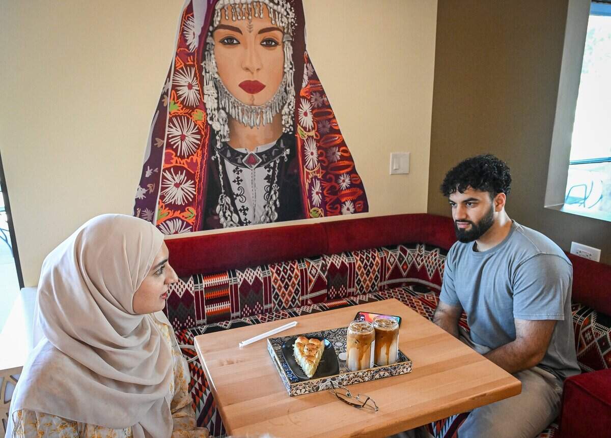 Asiyah Karim, left, and her husband Ibrahim Dastagir enjoy Yemeni coffee drinks and a sweet treat at Qamaria Yemeni Coffee Co. in northwest Fresno.