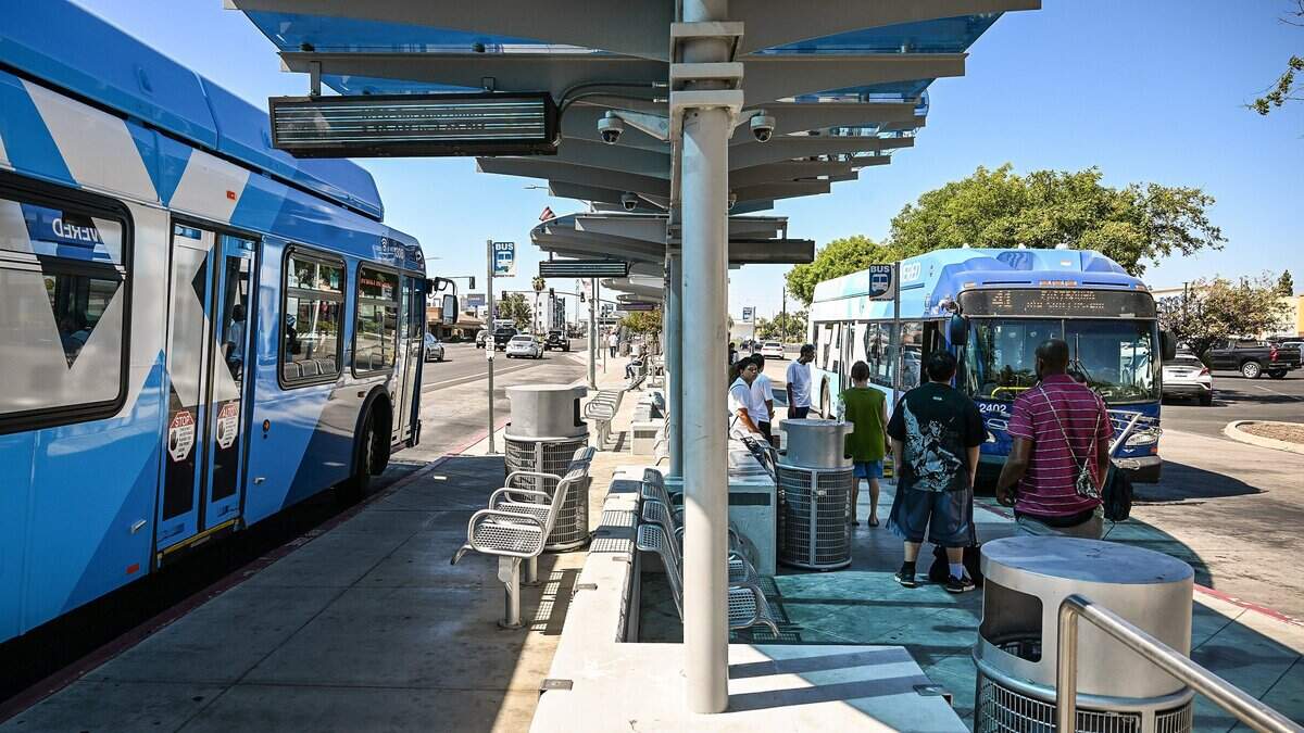 Fresno Area Express, or FAX, buses stop at the Manchester Transit Center to pick up and drop off riders on Wednesday, July 22, 2026. FAX is the primary public mass transit system serving the City of Fresno and parts of neighboring Clovis, California. The system is operated by the city's Department of Transportation which manages a fleet of over 100 buses that operate across nearly 20 fixed routes.