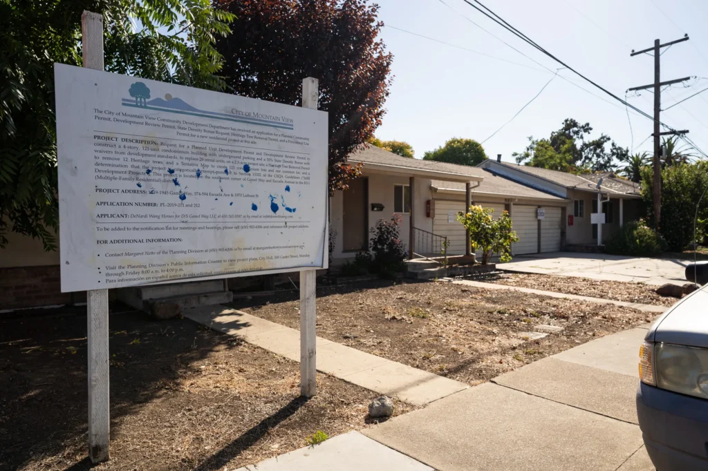 A development project sign in front of a home in Mountain View, California