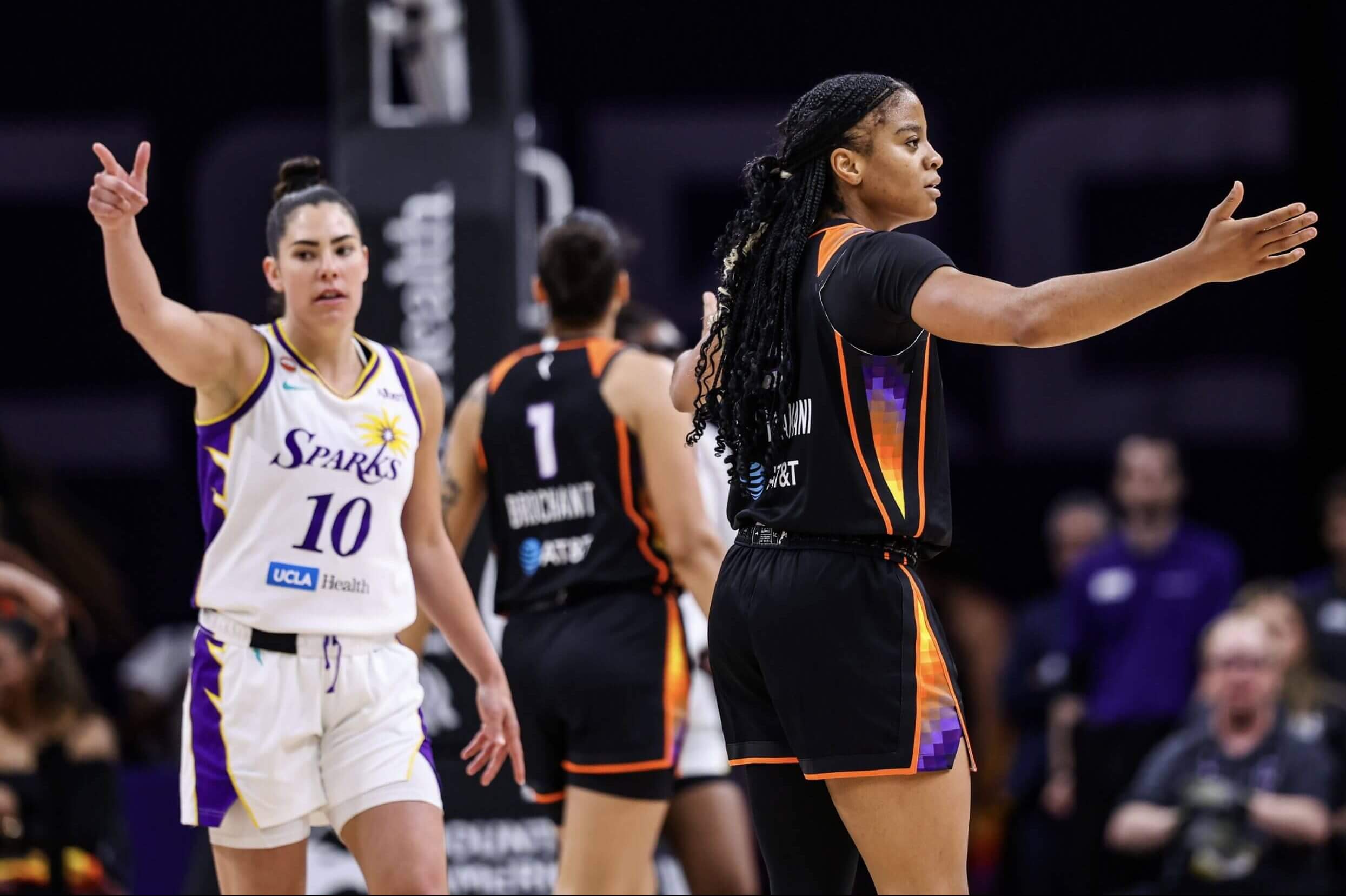 Kelsey Plum (10) and Monique Akoa Makani gesture during a game between Los Angeles and Phoenix.