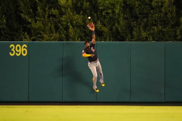 Angel Martinez makes a catch on a ball hit by the Angels' Mike Trout during the eighth inning Aug. 25 in Anaheim, Calif. (Mark J. Terrill/The Associated Press)