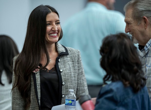 Sonja Shaw, president of the Chino Valley Unified board, talks with guests on Thursday, July 16, after a meeting. (Terry Pierson, The Press-Enterprise/SCNG)