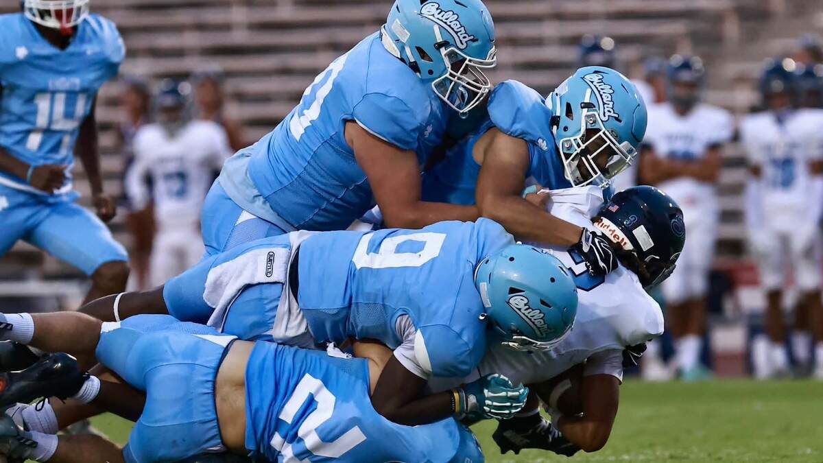 Bullard defensive players make a tackle on a Mayfair running back at Ratcliffe Stadium on Friday, Aug. 28, 2026.