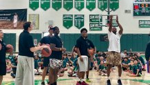 Norman Powell tossed a basketball, Saturday, inside the gym at Lincoln High School.
He and other sports professionals mentored children in basketball skills and drills, August 1, 2026.