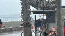 Beachgoers in La Jolla caught in sudden summer thunderstorms on Jug. 7, 2026.