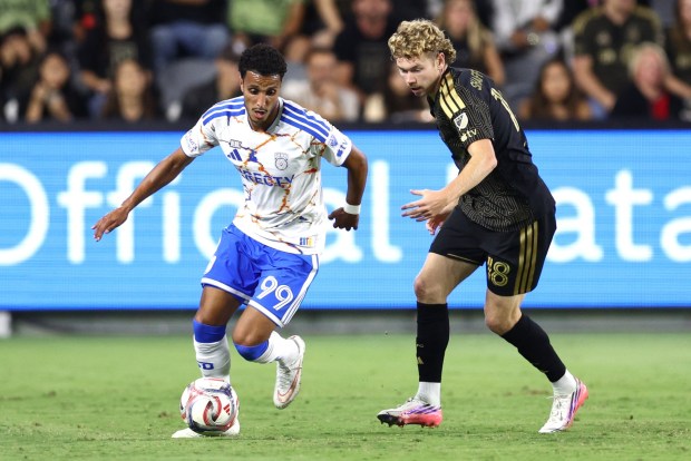 San Diego FC midfielder Elias Achouri (99) controls the Paul defended by Los Angeles FC forward Jacob Shaffelburg during the second half of an MLS match at BMO Stadium in Los Angeles, on Saturday, Aug. 15, 2026.  San Diego FC won 1-0.  Photo by Raul Romero Jr., Contributing Photographer)
