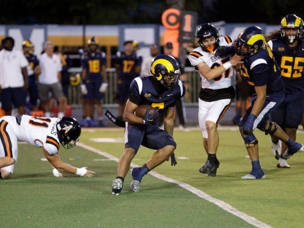 Millikan's Ryan Carter (7) looks to get through Huntington Beach's defense in Long Beach, CA, on Thursday, August 20, 2026. (Photo by Tracey Roman, Contributing Photographer)