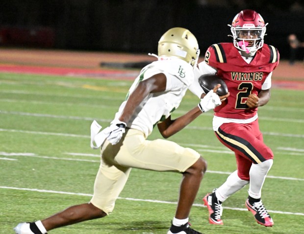 Downey quarterback Chase Watkins (2) carries in a non-league game and season opener against Long Beach Poly on Friday August 21, 2026. (Photo by Axel Koester, Contributing Photographer)
