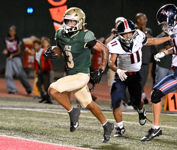 Long Beach Poly senior Jayden Coley (3) carries against Yorba Linda in a non-league game at Veterans Stadium in Long Beach on Friday August 28, 2026. (Photo by Axel Koester, Contributing Photographer)