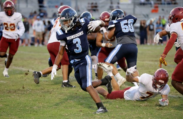 Mayfairs Jeromy Powell (3) races past Wilsons defense in Bellflower, CA, on Friday, August 21, 2026. (Photo by Tracey Roman, Contributing Photographer)