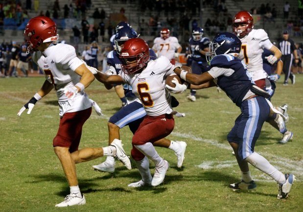 Wilsons Kyle Harris (6) races through Mayfairs defense in Bellflower, CA, on Friday, August 21, 2026. (Photo by Tracey Roman, Contributing Photographer)