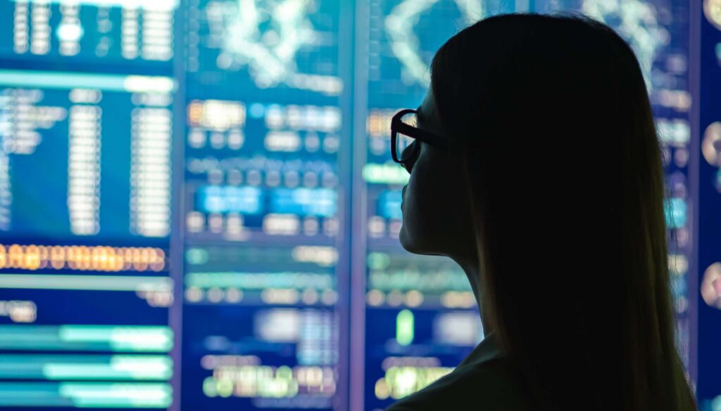 image of woman looking at data analytics on a screen 