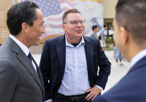 San Diego, CA - Current San Diego Unified School Board president and candidate for California Superintendent of Public Instruction, Richard Barrera, speaks with San Diego Mayor Todd Gloria and school staff before the first day of school at Patrick Henry High School on Monday, Aug. 10, 2026, in San Diego, CA. (Luke Johnson / The San Diego Union-Tribune)