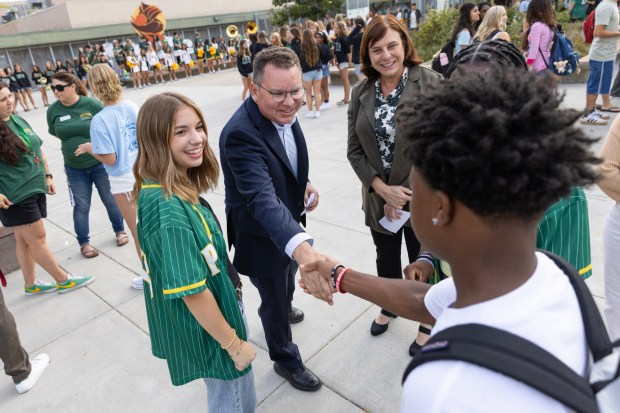 San Diego, CA - Current San Diego Unified School Board president and candidate for California Superintendent of Public Instruction, Richard Barrera, and board vice president Sabrina Bazzo speak with students before the first day of school at Patrick Henry High School on Monday, Aug. 10, 2026, in San Diego, CA. (Luke Johnson / The San Diego Union-Tribune)