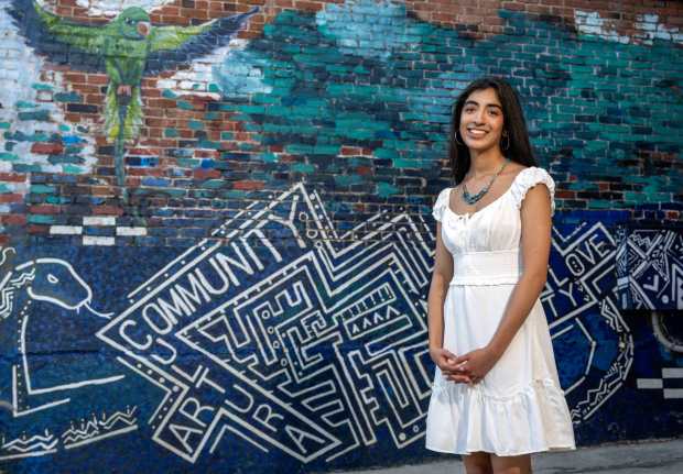 Sailee Charlu, 17, a student at Orange County School of the Arts and founder of Habla Futures Initiative, a platform geared towards expanding bilingual education, stands in an alley in Downtown Santa Ana where some of her favorite public art is on display on Friday, July 31, 2026. (Photo by Jeff Antenore, Orange County Register/SCNG)