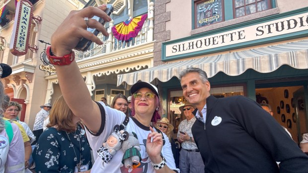 Raeanne Agueros takes a selfie with Josh D'Amaro, then the chairman of Walt Disney Parks and Resorts, on Main Street, U.S.A. during the 70th anniversary Disneyland on July 17, 2025, ￼in Anaheim, CA. ￼ (Photo by Jeff Gritchen, Orange County Register/SCNG)