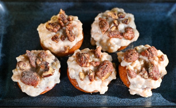 Arroz Con Leche Donut, a cinnamon sugar donut with arroz con leche, candied pecans and spiced chocolate powder, available at Lamplight Lounge at Pixar Pier inside California Adventure. Photographed on Friday, August 21, 2026, in Anaheim. (Photo by Jeff Gritchen, Orange County Register/SCNG)