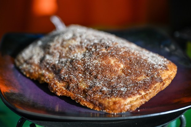 Churro Hand Tart, a pastry tart filled with spiced cake and topped with cinnamon and sugar, available at Market House on Main Street U.S.A. inside Disneyland. Photographed on Friday, August 21, 2026, in Anaheim. (Photo by Jeff Gritchen, Orange County Register/SCNG)