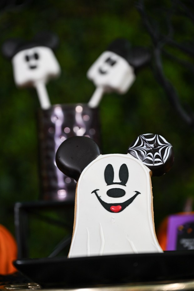 Mickey-shaped Ghost Cookie, a shortbread cookie dipped in chocolate, available at Jolly Holiday Bakery Cafe on Main Street U.S.A. inside Disneyland. Photographed on Friday, August 21, 2026, in Anaheim. (Photo by Jeff Gritchen, Orange County Register/SCNG)