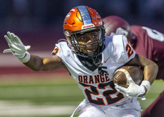 Orange wide receiver Tylen Taylor (22) carries the ball during a nonleague game against Laguna Beach in Laguna Beach on Friday, August 28, 2026. (Photo by Jeff Antenore, Orange County Register/SCNG)