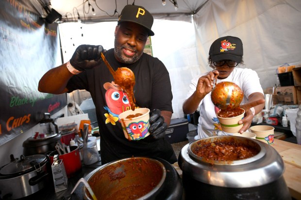 In this August 2024 file photo, Darrell Gillcrese serves up a bowl of his chili during the Malibu Chili Cook-Off. The fundraiser included a chili cook-off competition, a skateboard contest, an artisan marketplace and carnival rides. The event returns Labor Day weekend from Sept. 4-6. (Photo by Andy Holzman, Contributing Photographer)