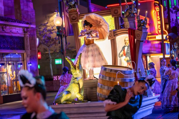 Tightrope walker Sally Slater in Madame Leota's Swinging Wake street party during Oogie Boogie Bash at Disney California Adventure. (Courtesy of Disneyland)