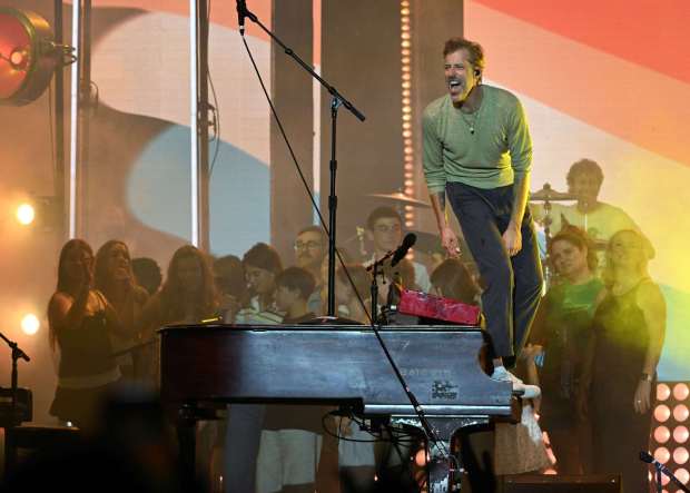 Andrew McMahon performs his last song of the night as kids from the families of band members gather around the piano for the Three Pianos tour, August 22, 2026, at the new F&M Bank Amphitheater of Long Beach. (Photo by Steven Georges, Contributing Photographer)