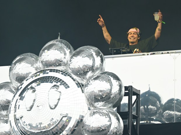 Disco Lines plays a song about disco and tequila as he holds up his drink at the Lands End stage during Outside Lands on Sunday, Aug. 9, 2026. (Chris Riley/Times-Herald)